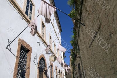 Foligno - Ancient buildings with pink flags