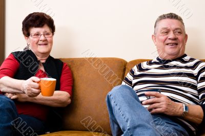Senior couple drinking cofee and talking