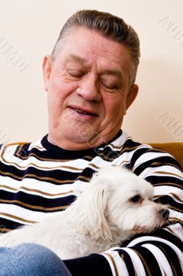Grandfather giving his dog a loving look