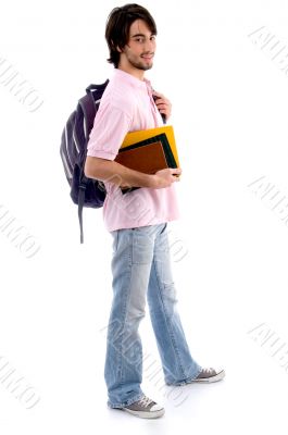 standing man with books and bag