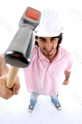 standing architect showing hammer