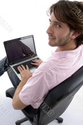 side view of man with laptop
