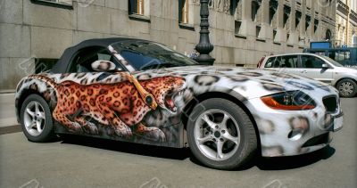 Cabriolet car with leopard aerography
