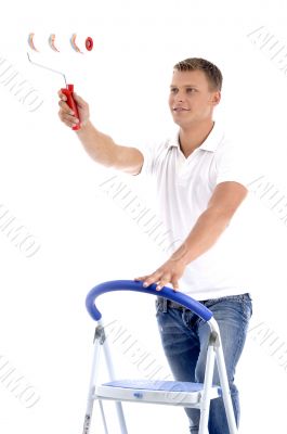 young guy holding painting brush