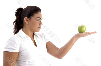 woman looking the apple