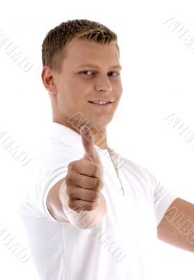 portrait of young guy gesturing thumbs up