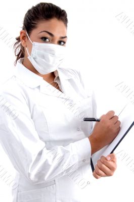 doctor posing with mask and writing board