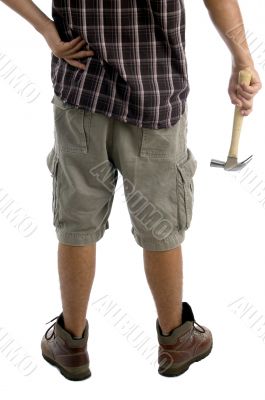 man`s hand holding hammer
