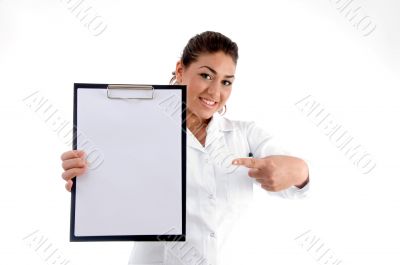 smiling doctor indicating the writing board