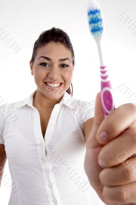 beautiful woman showing her toothbrush