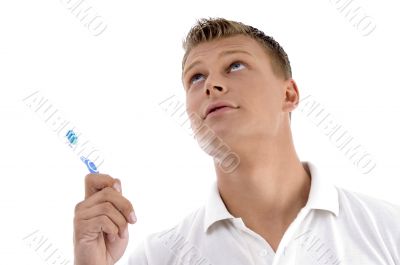 healthy male posing with toothbrush