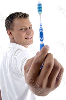 man showing his toothbrush