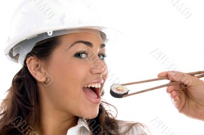 pretty architect eating with chopstick