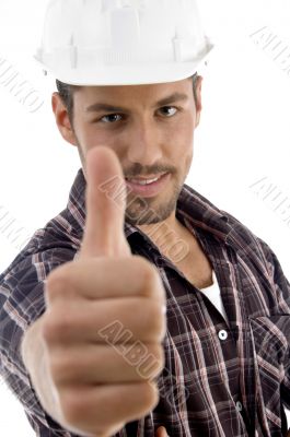 portrait of young guy gesturing thubmbs up