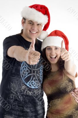 happy young couple wearing christmas hat