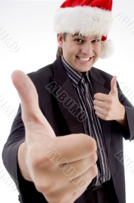 businessman in christmas hat wishing goodluck