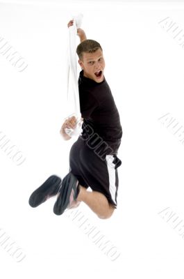 jumping man holding towel