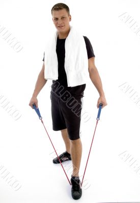 standing man with exercising rope