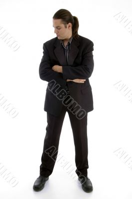 standing businessman with folded hands