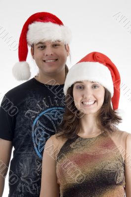 happy young couple wearing christmas hat