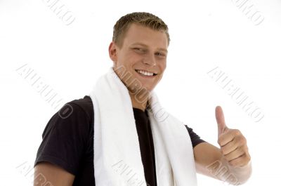 smiling man showing thumb gesture