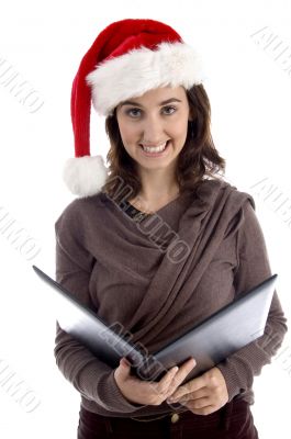 business woman holding files and wearing hat
