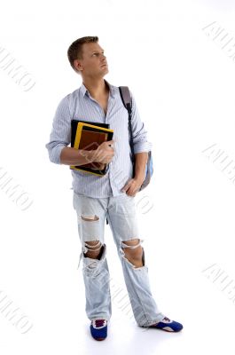 full body pose of student holding his books