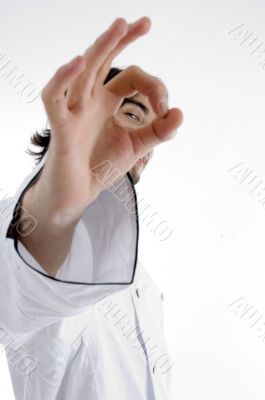 smart chef looking through finger hole