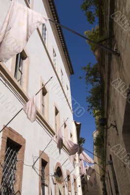 Foligno - Ancient buildings with pink flags