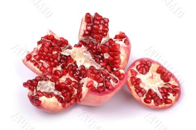 Broken pomegranate on white