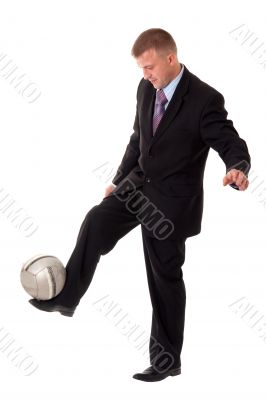 Young businessman with football