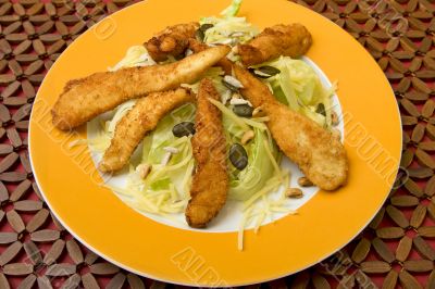 Salad with turkey stripes