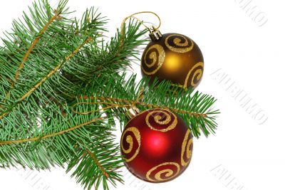 Two ball ornaments with pine.