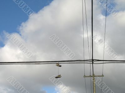 shoes hanging on electric wires