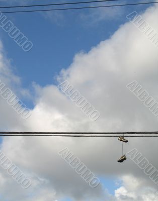 shoes hanging on electric wires