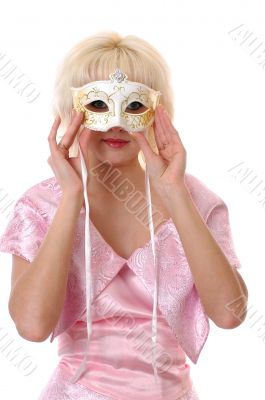 A doll-looking woman under the venetian mask