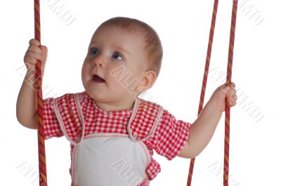 happy little kid playing with swing