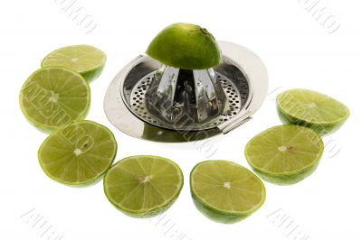 Limes with lemon squeezer