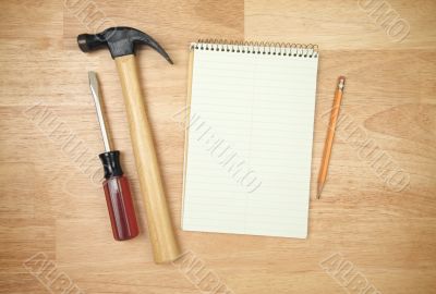 Pad of Paper, Pencil, Hammer and Screwdriver