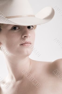 Sexy portrait of a red haired Cowgirl