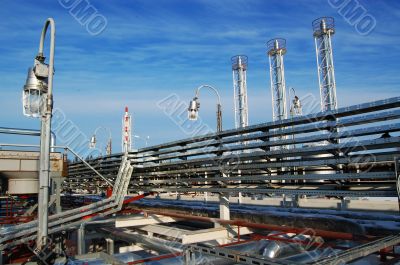 Industrial zone, Steel pipe-lines on blue sky
