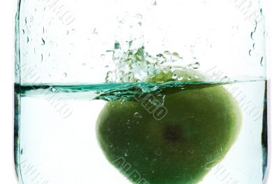 Splashing green apple
