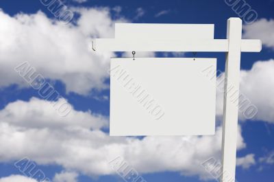 Blank Real Estate Sign on Clouds & Sky Background