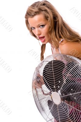 Sexy young girl uses the fan