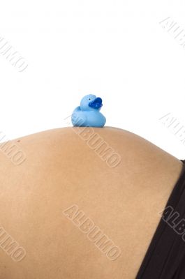 30 weeks pregnant teenager with blue duck on her belly