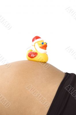 30 weeks pregnant teenager with christmas duck on her belly