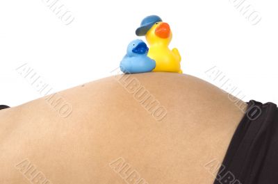 30 weeks pregnant teenager with two ducks on her belly