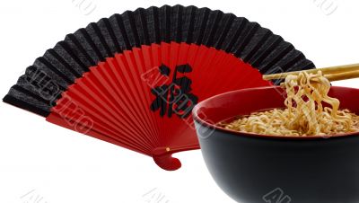 noodle soup asian with chopsticks and red fan