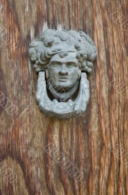 old bronze door knocker man head