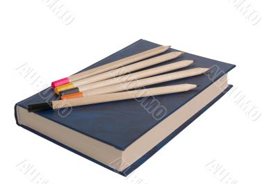 Book and five pencils.